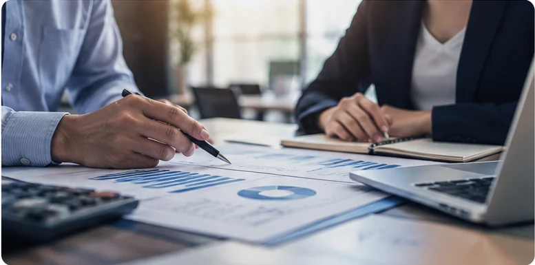 Business professionals reviewing financial and operational performance data